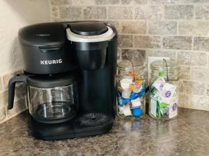 a coffee maker sitting on top of a counter at Copper Voyage, Fenced Backyard in Coeur d'Alene +22 photos