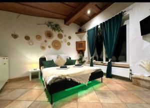 a bedroom with a bed and a large window at Green Oasis Stylish Garden Studio Workspace in Linz