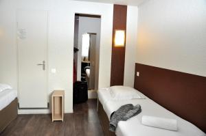 Postel nebo postele na pokoji v ubytování B Hotel Caen Mondeville