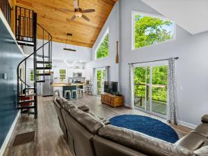 a living room with a couch and a table at Jax Joint - Pet Friendly - Perfect Family Vacation Spot! in Crane Hill