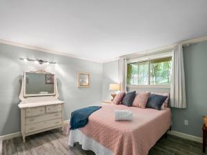 a bedroom with a bed and a television on a dresser at Sheltered Cove - Family-Friendly With Lots Of Options! in Jasper