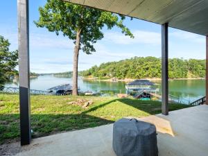 a view of a lake from the porch of a house at Sweet Retreat - Great Views Of The Lake! in Houston