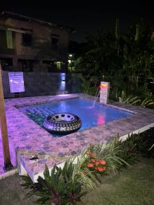 a swimming pool with a tire in the middle of it at Cozy one bedroom & Car rental apartment in Lambeau