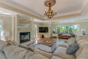 a living room with a couch and a fireplace at Yellowhammer Hill - Amenities Galore! Near Cullman in Cullman