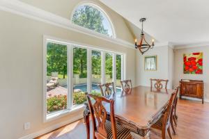 a dining room with a table and a large window at Yellowhammer Hill - Amenities Galore! Near Cullman in Cullman