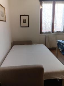 a bedroom with a bed in a room at Lo Studio in Pioltello