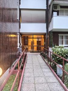 a walkway leading to the front door of a building at Lo Studio in Pioltello