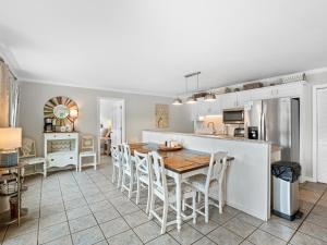 a kitchen and dining room with a table and chairs at Cranes Nest - Huge Dock With Two Kayaks For The Guest's Use! in Crane Hill
