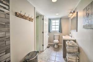 a bathroom with a toilet and a sink at Cranes Nest - Huge Dock With Two Kayaks For The Guest's Use! in Crane Hill +32 photos