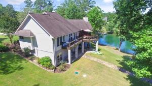 an aerial view of a house with a lake at L & L Lodge - Six Bedrooms! Popular House And Location! in Double Springs