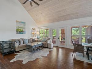 a living room with a couch and a table at L & L Lodge - Six Bedrooms! Popular House And Location! in Double Springs