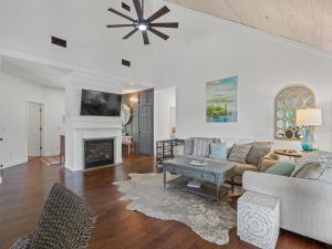 a living room with a couch and a fireplace at L & L Lodge - Six Bedrooms! Popular House And Location! in Double Springs
