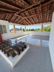 a large room with a tile floor and a wooden ceiling at Casa Vemisa Puerto Escondido in Puerto Escondido