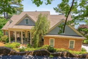 a home with a brick house at Lake Therapy - Gazebo On The Lake, Easy Walk To The Water! in Crane Hill