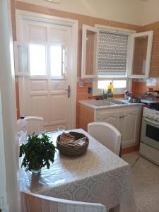 a kitchen with a table with a basket on it at Maryline house in Bizerte