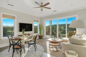 a living room with a table and a couch at Mallard Pointe Unit 200- Luxury Condo- Conveniently Located! in Cullman