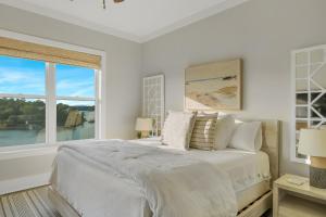 a white bedroom with a large bed and a window at Mallard Pointe Unit 200- Luxury Condo- Conveniently Located! in Cullman +32 photos