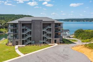 an aerial view of a building with a road at Mallard Pointe Unit 200- Luxury Condo- Conveniently Located! in Cullman