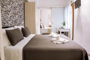Postel nebo postele na pokoji v ubytování Venere Rooms