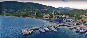 a group of boats are docked in a harbor at arome de grenade in Nea Epidavros