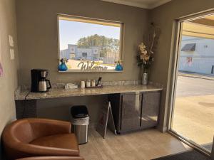 a living room with a counter and a window at Driftwood Inn - Lake City in Lake City