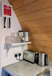 a kitchen with a counter top with a toaster and a toaster at Glamping at Honnington Farm in Royal Tunbridge Wells