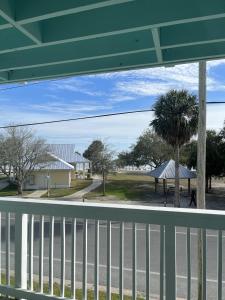 a view of a street from a balcony at Renovated Ocean-View Condo with Private Balcony in Cedar Key