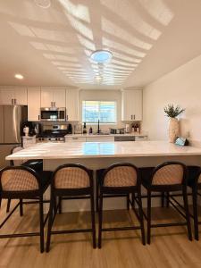 a large kitchen with a large table and chairs at Beach Paradise- 4 Min Walk To Beach in Santa Cruz