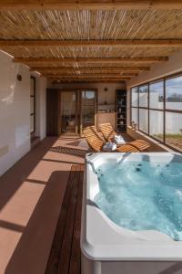 a hot tub in the middle of a living room at Suite & Spa Carignano Grande in Nardò