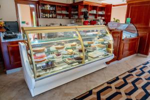 a display case with food in it in a store at Kala B&B in Kranjska Gora