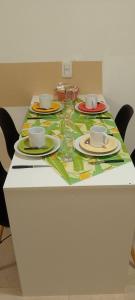 a table with plates and cups on top of it at Edificio San Jose in Federación