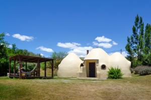a small house with a swing and a playground at Valle de Domos - Minas in Minas