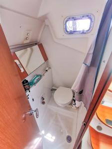 a small toilet in the back of a boat at Voilier in Propriano