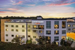 an exterior view of a building with acourt yard apartments at Courtyard by Marriott Oxford in Oxford