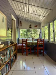 a dining room with a table and two chairs at Casa 3 habitaciones in Tigre