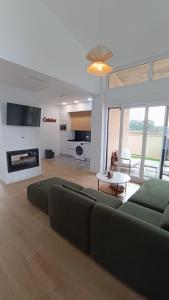 a living room with a couch and a table at Casa Huidobro Valle II in Sardón de los Frailes