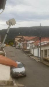 a car parked on a street in a town at Mini Casa Tiradentes 2 in Tiradentes