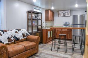a living room with a couch and a kitchen at Basement apartment in Twin Falls