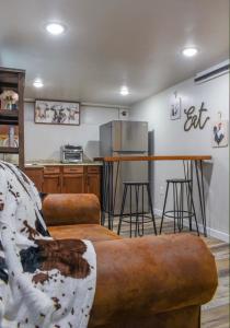 a living room with a couch and a kitchen at Basement apartment in Twin Falls +3 photos