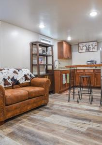 a living room with a couch and a kitchen at Basement apartment in Twin Falls