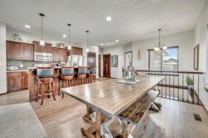 a large kitchen with a wooden table in a room at Bridges Bay Vacation Cabin 185 in Arnolds Park