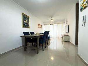 a dining room with a table and chairs at Relaxing & New Retreat 3 bedroom riviera Verde in Santo Domingo