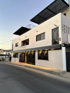 a building on the side of a street at The Cabo Cush Hotel in Cabo San Lucas