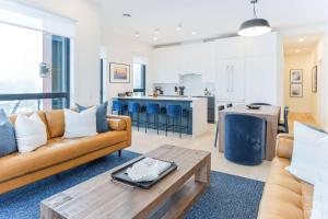 a living room with a couch and a table at The View - Luxury Penthouse Condo in Revelstoke