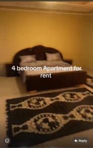 a bedroom with a bed with a platform appointment for rent at BUSUMBALA RESIDENTs in Busumbala