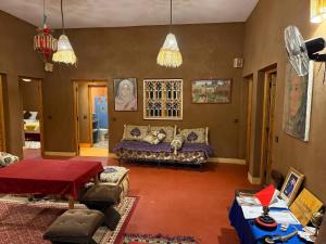 a living room with a couch and a table at Dar Talhaya in Oulad Driss