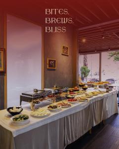 a buffet line with many plates of food on it at BAZAAR HOTEL Center in Tirana