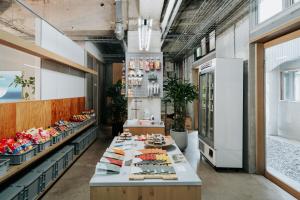 a store with a long counter with different types of food at KOTOBUKI Hotel in Kanoya