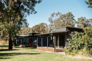 a modern house with a black facade at Buller Wines in Rutherglen