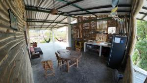 a room with a table and chairs in a room at Casa Grulla in Santa Marta